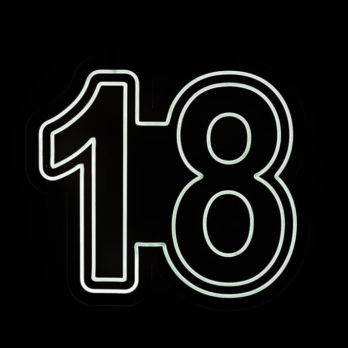 A neon sign in the shape of the number 18 with a playful font, glowing in white color.