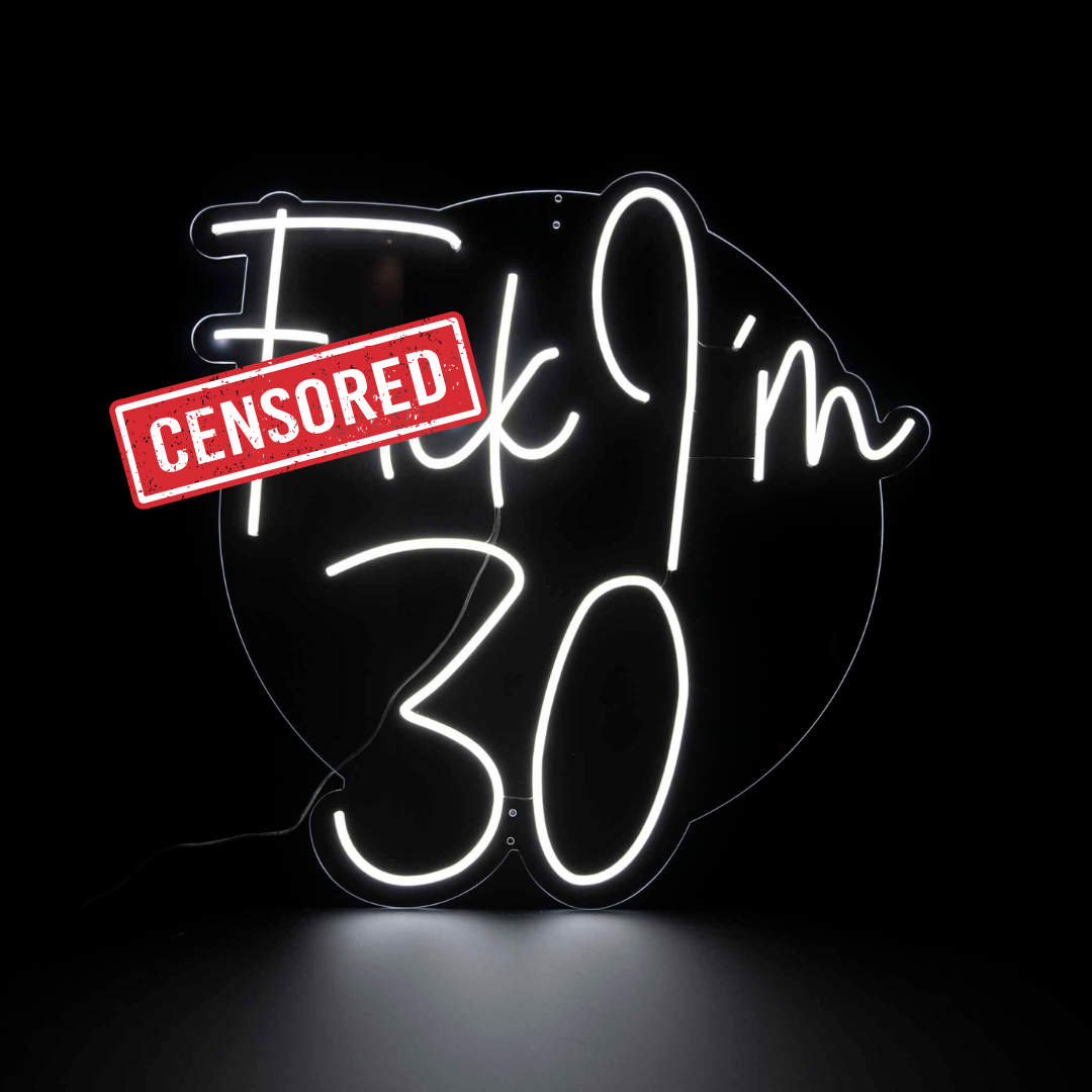 Fuck I'm 30 white neon sign on a clear clear acrylic backing board with censored sticker