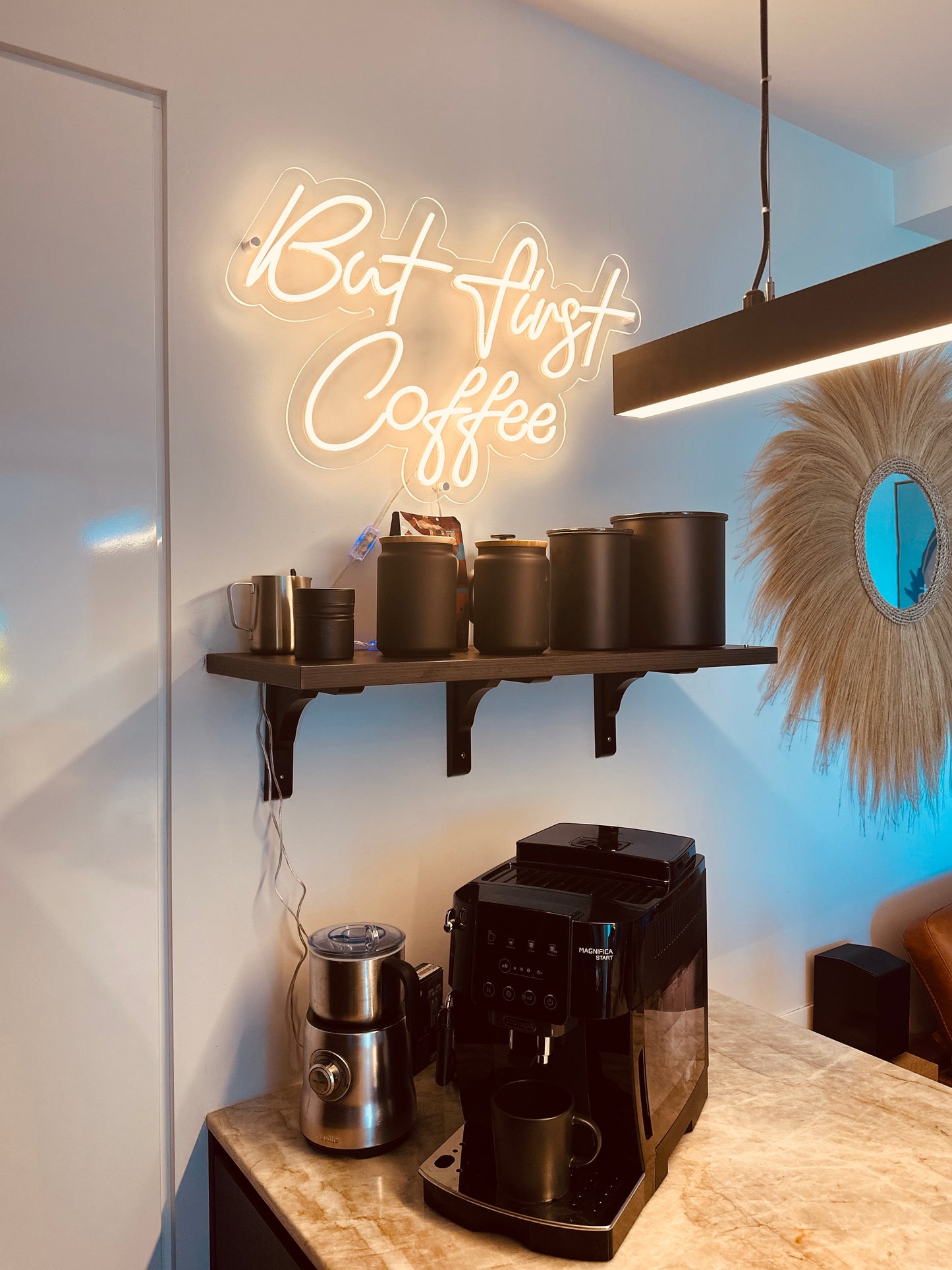 but first coffee in a bright white neon sign above a coffee machine
