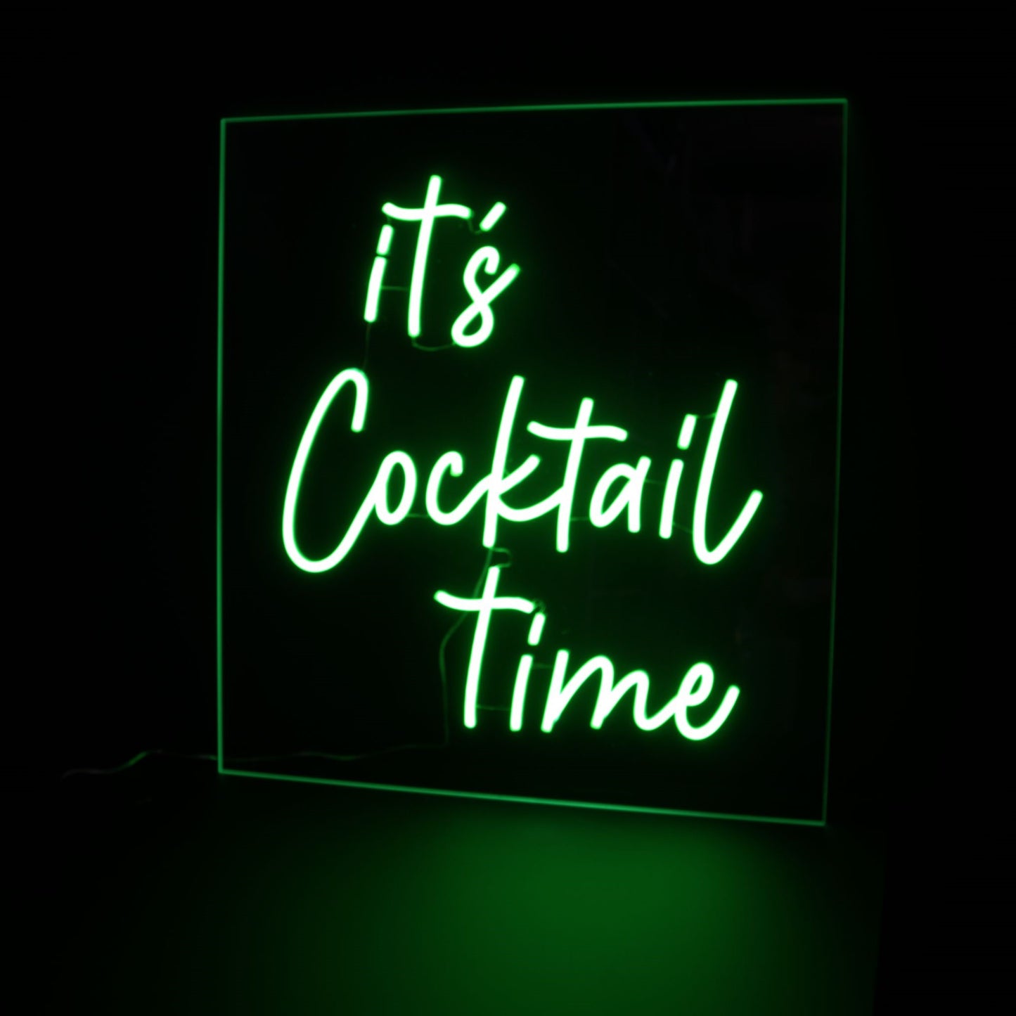 It's cocktail time green neon light for bar area on a black ackground