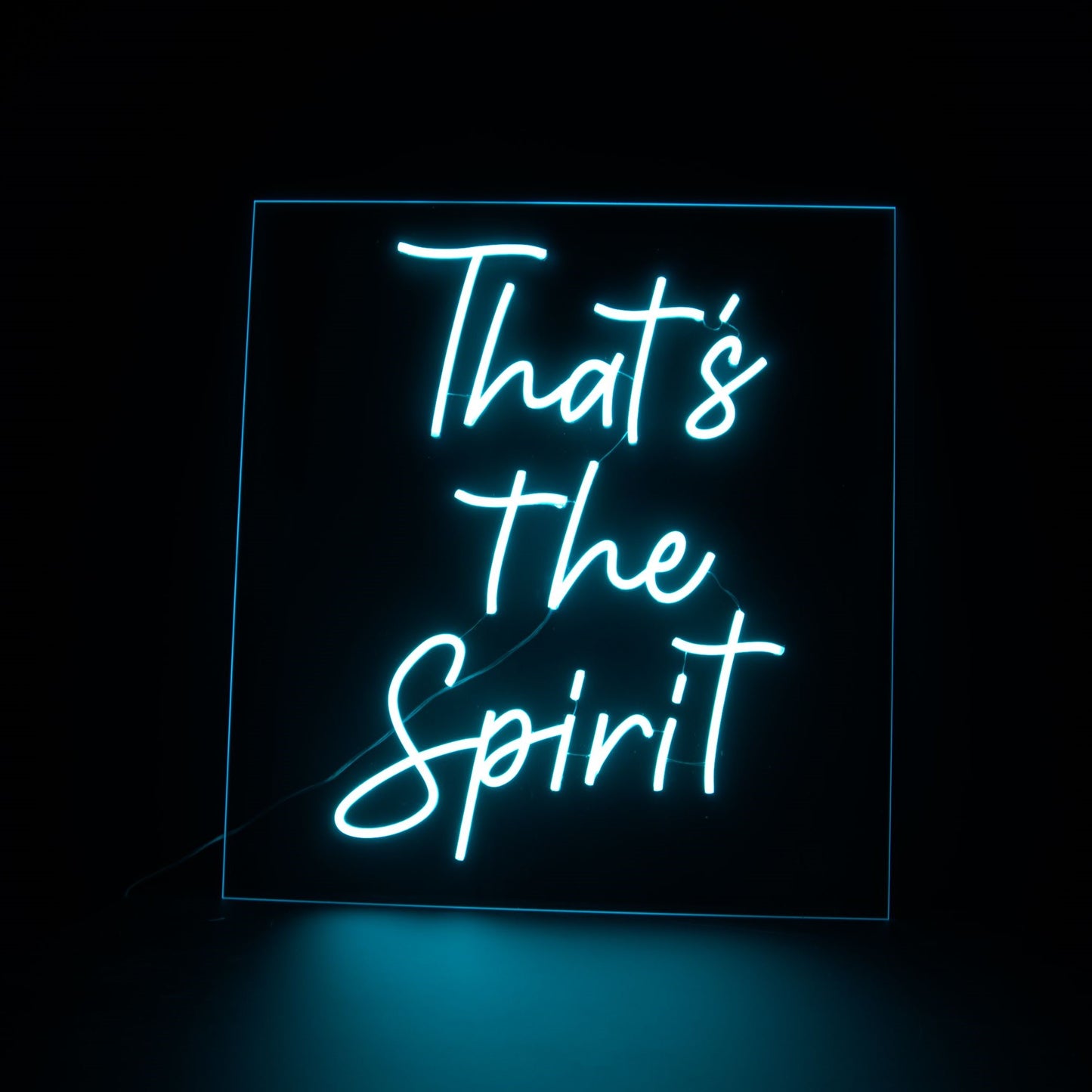 That's the spirit blue neon sign on a black background