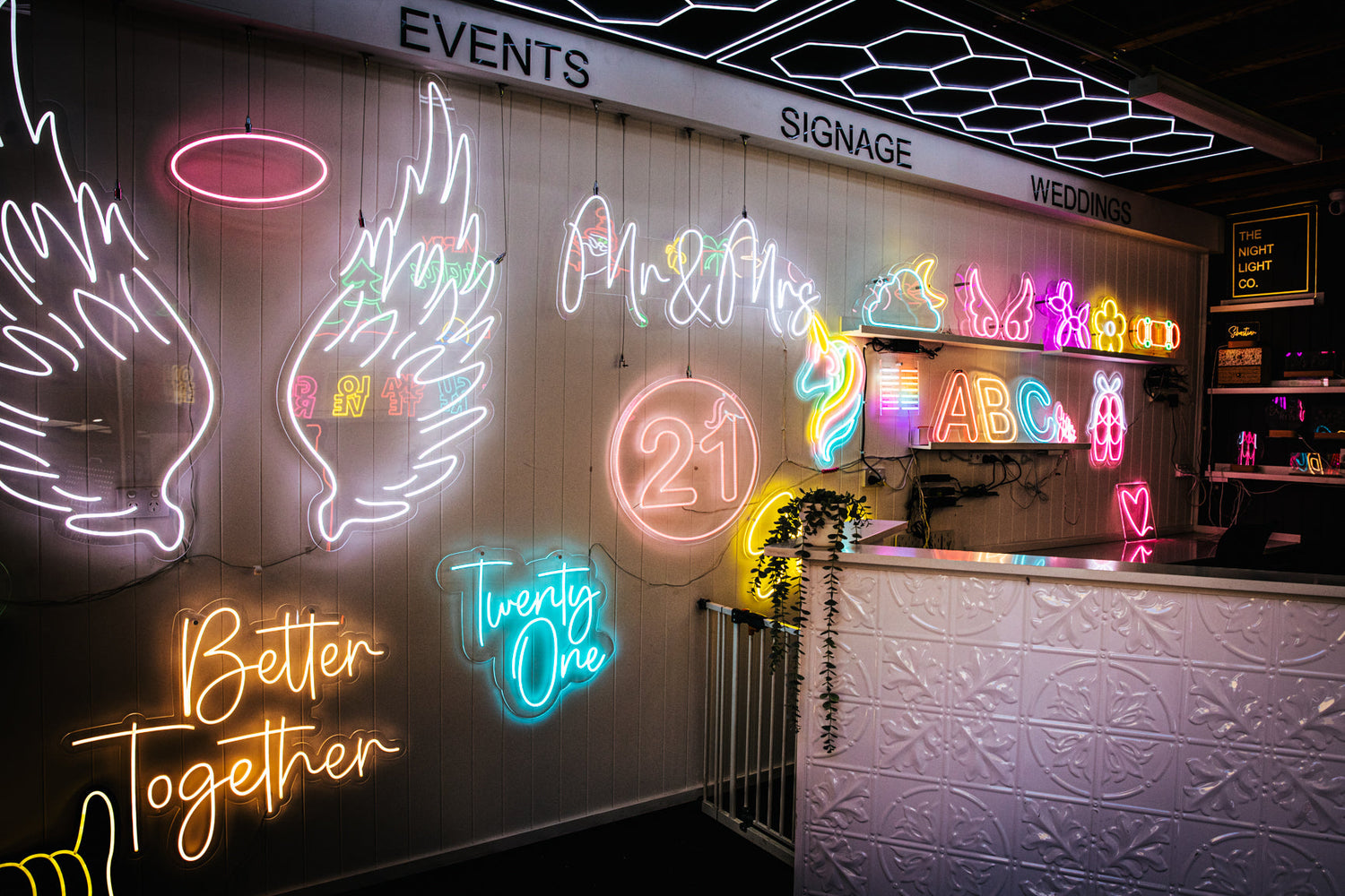 showroom wall full of bright illuminated neon lights