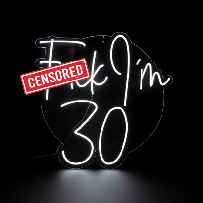 Fuck I'm 30 white neon sign on a clear clear acrylic backing board with censored sticker