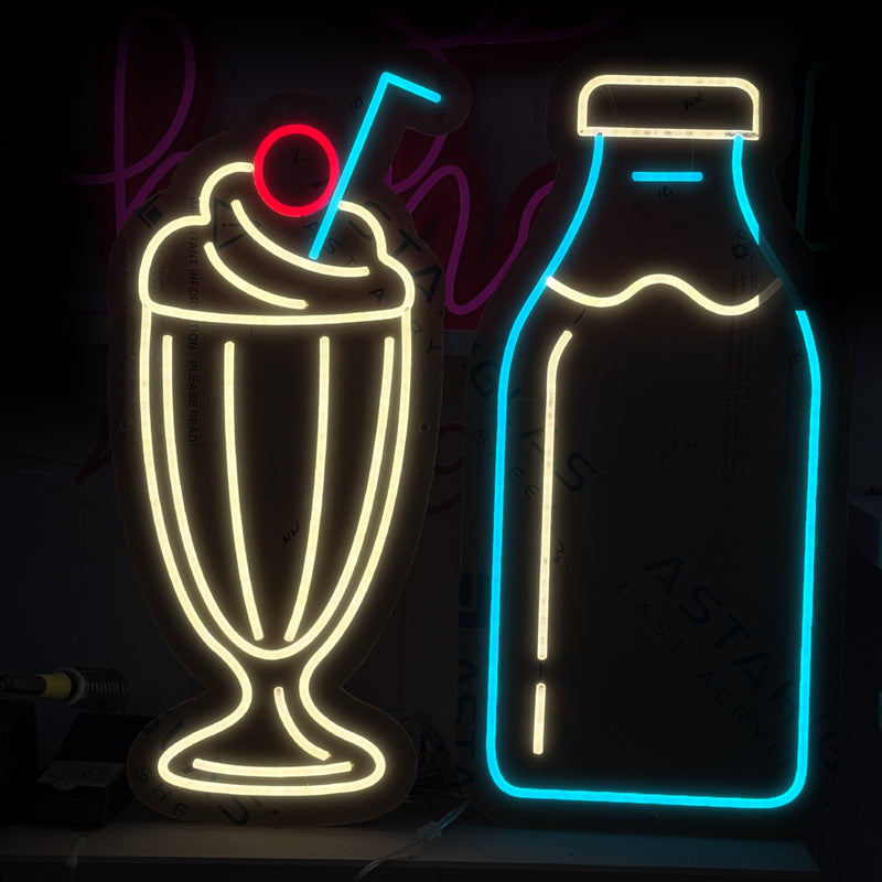 Milkshake and milk bottle neon signs for Alex Milk Bar, in warm white, red and aqua