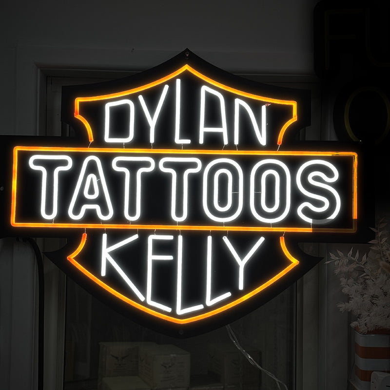 Dylan Kelly Tattoos shield logo neon sign in white and orange