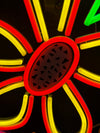 close up of an orange and yellow stylised neon light