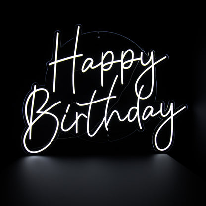A neon sign that reads 'Happy Birthday' in a cursive font, glowing in white against a black background.