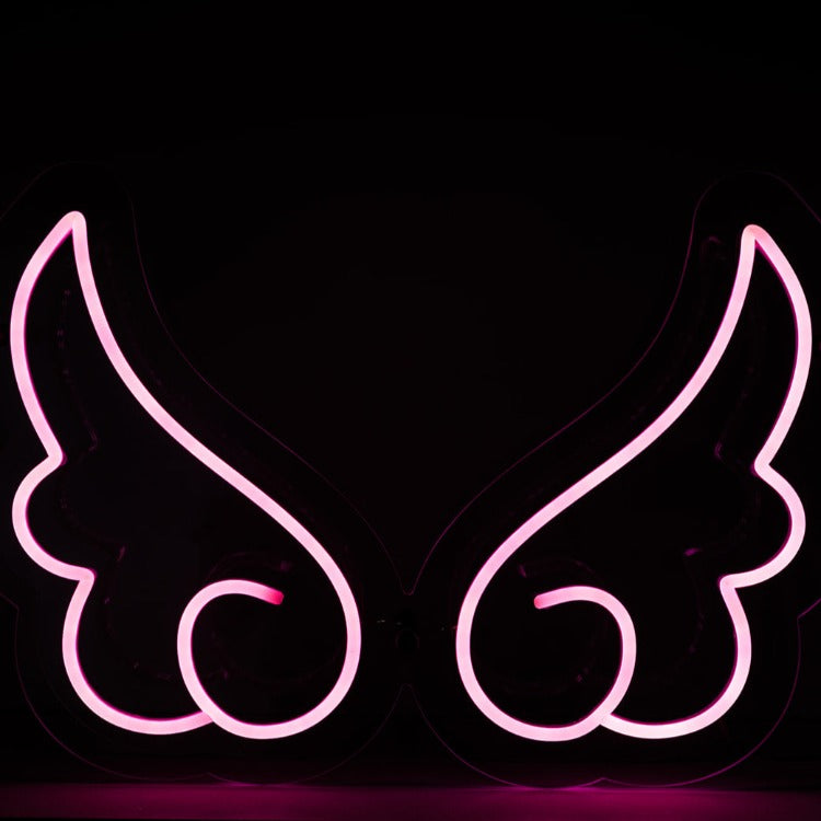 pink-neon-angel-wings-sign-on-a-black-background