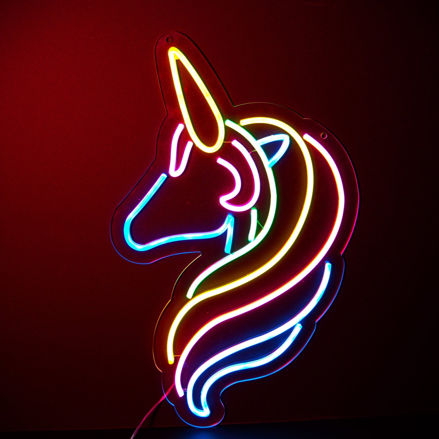 a muti coloured stylised unicorn neon artwork