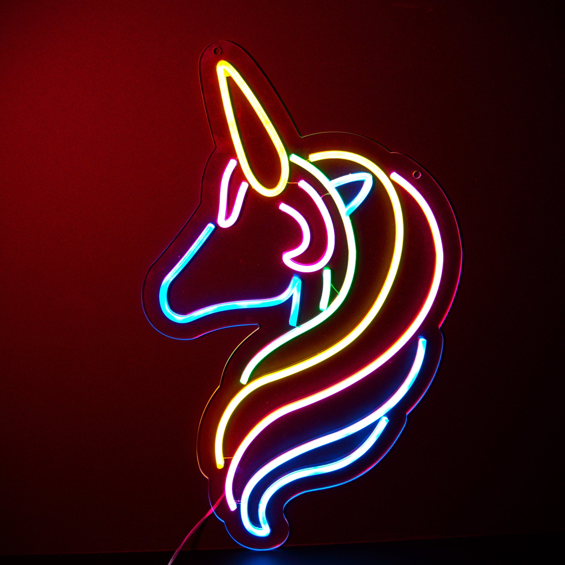 a muti coloured stylised unicorn neon artwork