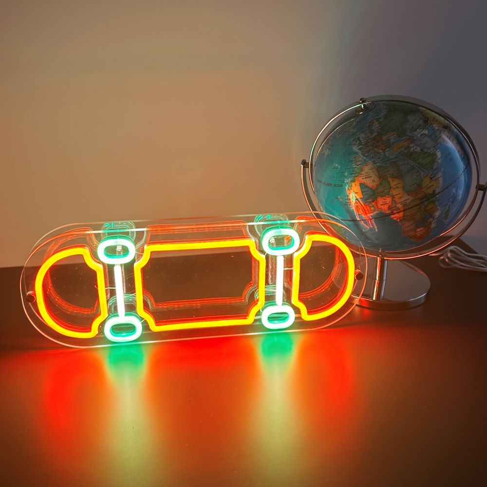 clear-acrylic-shape-skateboard-with-orange-green-and-white-neon-flex-sign-standing-next-to-a-world-globe