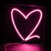 a funky pink heart outline neon light with a warm soft glow