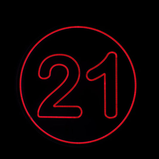 round red bold 21 neon sign  with a bright circle border on a black back ground