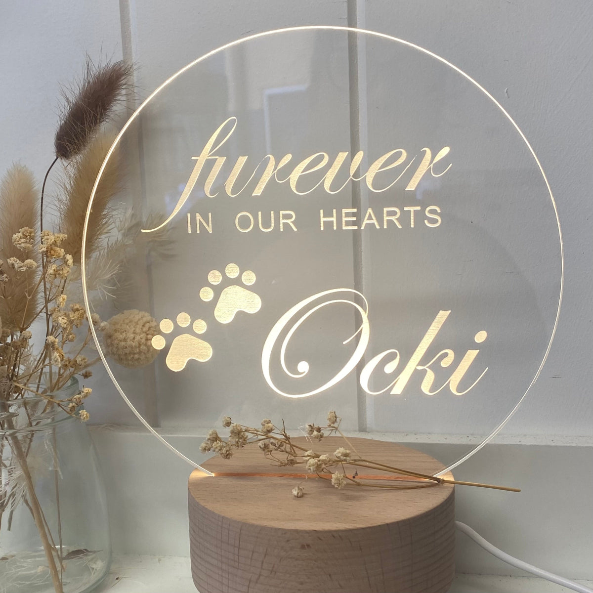 round shaped memorial night light engraved with furever in our hearts, a little set of paws and the puppies name.